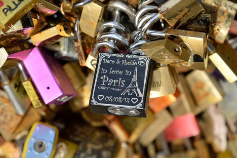 Love padlocks attached to the railing of the Pont de l'Archevêché bridge, Paris, France, Europe