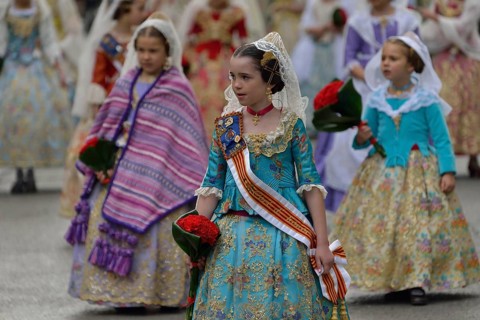 Fallas festival, girls in a traditional costume during the parade in the Plaza de la Virgen de los