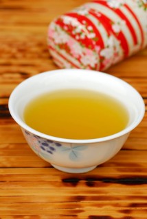 Cup of green tea, tea tin, green tea, green tea