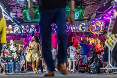 Crowds of people on Bangla Street in the evening. Nightlife on Bangla Walking Street with go-go