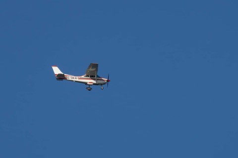 Cessna F182Q Skylane aircraft flying in a blue sky, England, United Kingdom, Europe