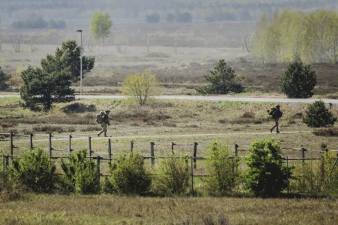 Two armed soldiers, photographed as part of a Bundeswehr exercise with forces from Norway and the
