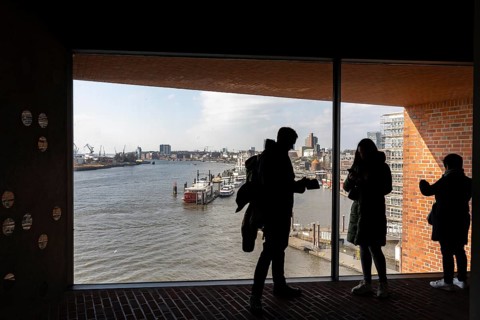 View from the visitor level of the Elbe Philharmonic Hall, tourists on the Elbe and Hamburg at the