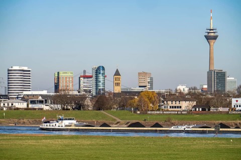 The skyline of Düsseldorf, with the skyscrapers in the Media Harbour, Rhine Tower, in front