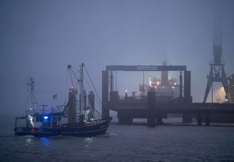 Thick fog in winter, hangs over the mouth of the Elbe into the North Sea, fishing boat, shrimp