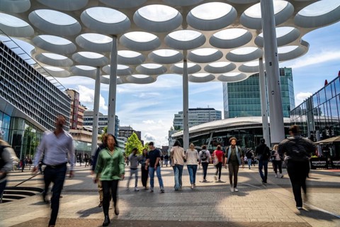 Station forecourt of Utrecht Centraal station, people on their way to and from the station, Hoog
