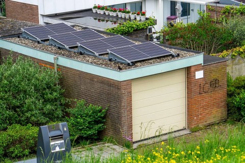 Solar modules on roofs, here on a car garage, Vlissingen, Netherlands