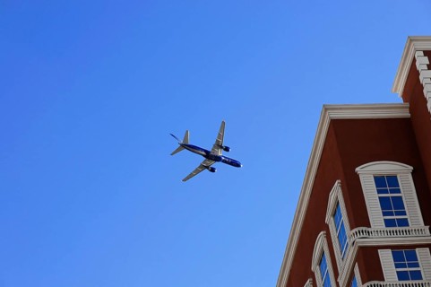 Las Vegas, Nevada, USA, North America, aeroplane in the clear blue sky, next to a large