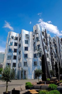 Building by architect Frank O. Gehry with a strikingly corrugated and mirrored surface in