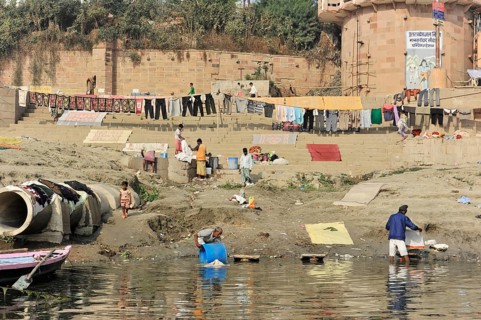 Varanasi, Uttar Pradesh, India, Asia, People on the river bank washing and drying clothes under the