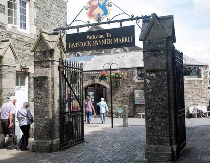 Traditional market place and building with welcome sign, Pannier Market, Tavistock, Devon, England,