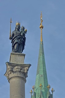 Madonna figure with golden crown and blurred spire of Our Lady, Minster, sceptre, baby Jesus, arm,