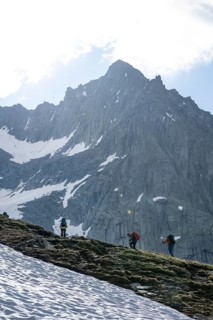 Mountaineer on a hiking trail, ascent to Schönbichler Horn, rocky summit Furtschaglspitze in the