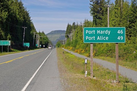Grader Highway with distance to Port Hardy and Port Alice, Vancouver Island, British Columbia,