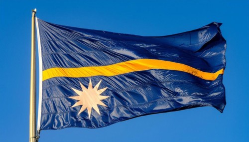 The flag of Nauru, an island nation in the Pacific Ocean, flutters in the wind, isolated against a
