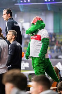 A green mascot entertains the spectators at a sporting event, Mercedes Benz Junior Cup, Glaspalast