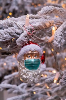 Symbolic image of Christmas in the Corona crisis, Father Christmas figure, Christmas tree