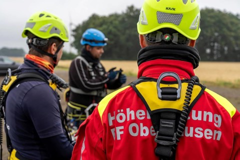 Height rescuers from the Oberhausen fire brigade practise abseiling from a wind turbine from a