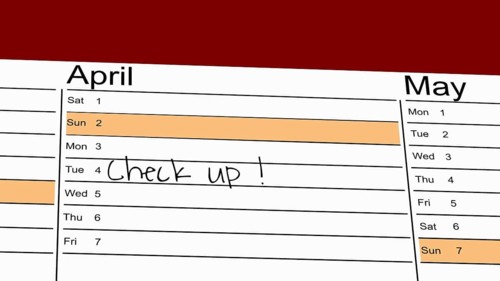 Symbolic image: Appointment diary with note for preventive medical check-up (English)