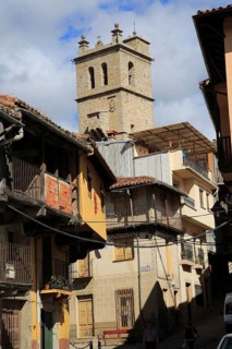 Church tower traditional houses with balconies, Garganta la Olla, La Vera, Extremadura, Spain,