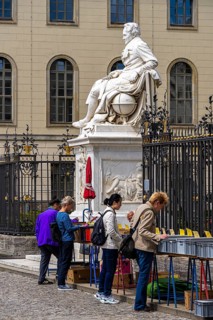 Tourists at the flea market stall in front of Humboldt University, Unter den Linden, Berlin,