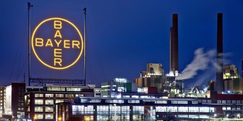 Bayer cross in the blue hour on the premises of Bayer AG, Leverkusen, Bergisches Land, North