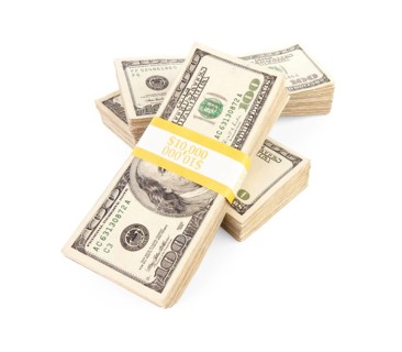 Ten thousand dollar stacks of one hundred dollar bills isolated on white