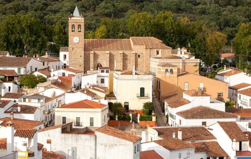 Church and houses in village of Almonaster La Real, Sierra de Aracena, Huelva province, Spain,