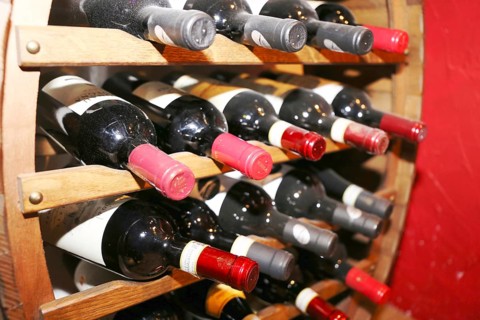 Wine cellar with red wine bottles