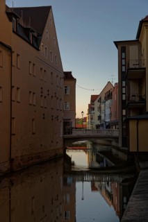 Last rays of sunshine over the river Vils surrounded by houses, Amberg, Upper Palatinate, Bavaria,