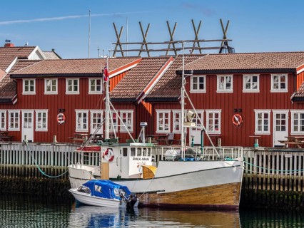 Typical red wooden houses at the harbor, Svolvær, Lofoten, Norway, Europe