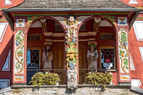 Historic town hall, Renaissance half-timbered house, portal above open staircase, colourful painted
