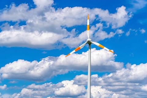 Wind turbine, wind energy plant from the manufacturer Enercon, blue sky with many white clouds,