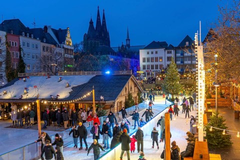 Ice rink at the Christmas market on the Heumarkt in the old town of Cologne, Cologne Cathedral,