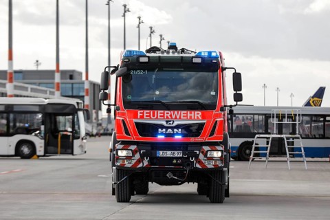 Airport fire brigade fire engine on the BER tarmac during an EASA emergency exercise. Emergency