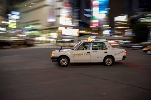 Taxi on the Shibuya intersection, most frequented intersection of the world, Shibuya, Tokyo, Japan,