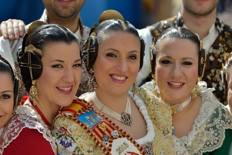 Fallas festival, women in a traditional costume during the parade in the Plaza de la Virgen de los
