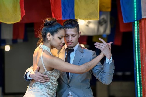 Tango dancers on the street in the port district of La Boca, Caminito, Buenos Aires, Argentina,