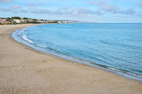 Breaking waves on a sandy beach, sunny, near Tarragona, Catalonia, Spain, Europe