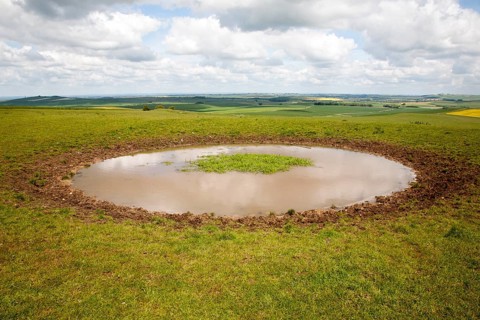 Dew pond water supply on the top of Tan Hill, All Cannings, Wiltshire, England, United Kingdom,