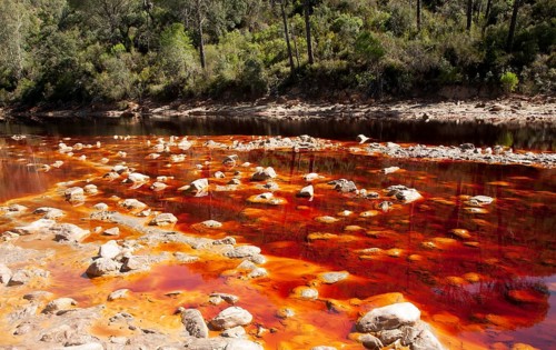 Blood red mineral laden water Rio Tinto river Minas de Riotinto mining area, Huelva province,