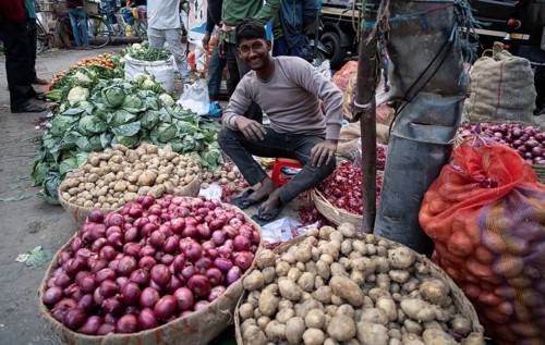 Vendor selling vegetables at a market, ahead of the presentation of the Interim Budget 2024 by