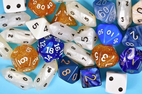 Different blue, white and golden roleplaying RPG dice