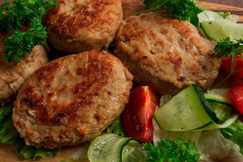 Fried cutlets, turkey, with vegetable salad, top view, no people