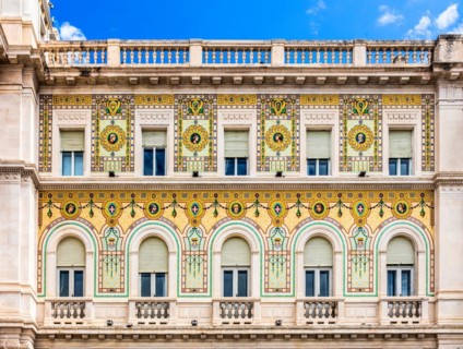 Palazzo del Governo with oriental-looking golden mosaic tiles, Piazza Unità d'Italia in the heart