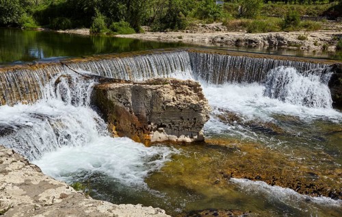 Waterfalls with limestone cliffs of the Sautadet cascades near La Roque-sur-Cèze, Gard department,