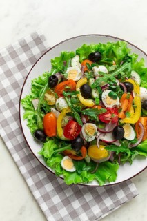 Vegetable salad, with quail eggs and olives, fresh, close-up, no people