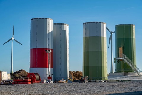 Construction site of a new wind turbine, modules of the tower, wind turbine from the manufacturer