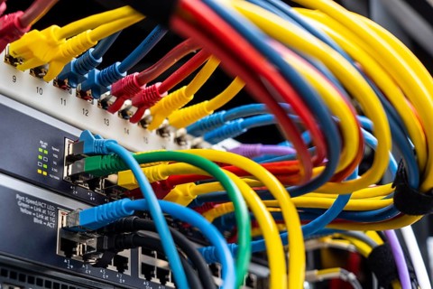 Cable to a company computer server, various networks converge centrally on the server