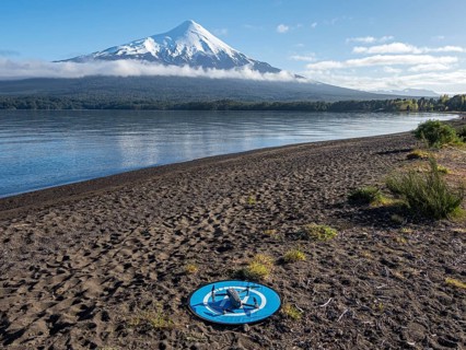 Drone on a landing pad at beach Playa Ensenada, lake Llanquihue, volcano Osorno, chilenean lake